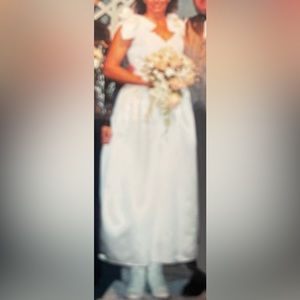 Wedding dress, worn once than dry cleaned and stored in tight sealed box